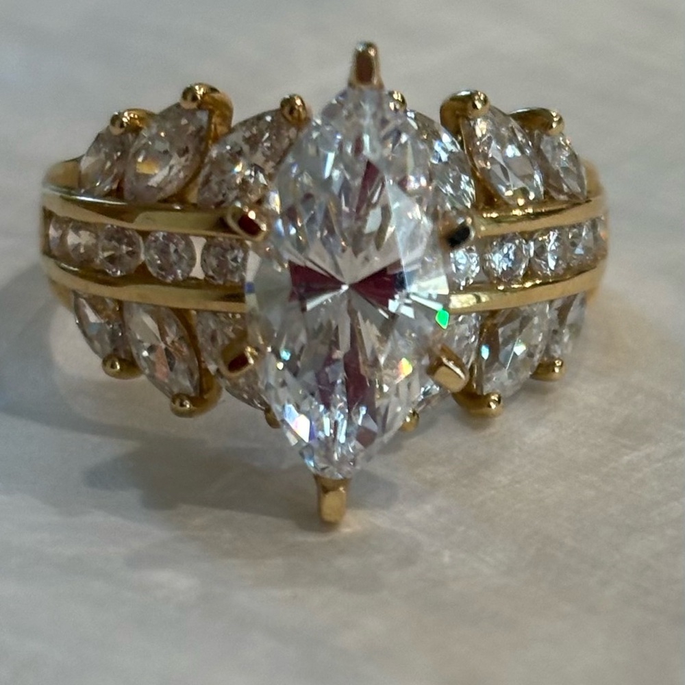 Diamonique marquise center stone ring in 14k gold accented by 22 accent stones